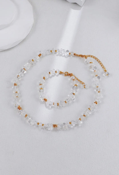 Pulsera de cuentas doradas y cristal blanco