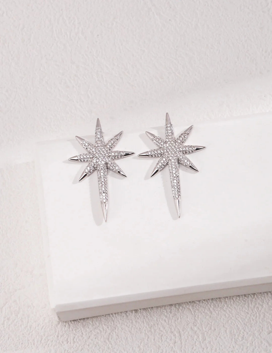 Pendientes tipo botón en forma de estrella