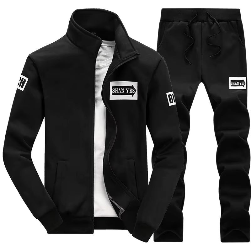 Conjunto deportivo de otoño para hombre. Sudadera y pantalón a juego, con diseño patchwork, cuello alto y capucha.
