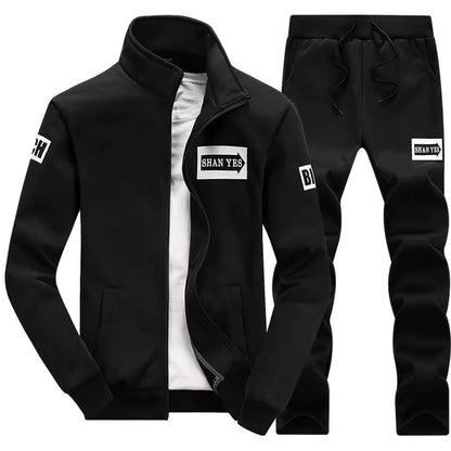 Conjunto deportivo de otoño para hombre. Sudadera y pantalón a juego, con diseño patchwork, cuello alto y capucha.
