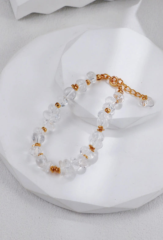 Pulsera de cuentas doradas y cristal blanco